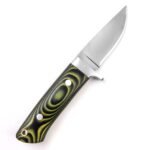 Angled view of fixed-blade knife with silver-colored blade and green-black patterned handle featuring a metal-lined circular hole.