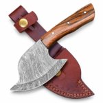 Damascus-style Viking bearded axe with a curved patterned blade, brown wood-grain handle, and stitched reddish-brown protective sheath with brass-colored snap fasteners.