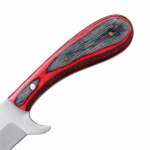 Close-up of curved red-and-black knife handle showing dark wood-grain-like texture, layered colored edges and circular metallic pins.