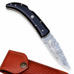 Damascus Pattern Folding Knife with silver-gray layered blade design, curved glossy black handle, silver-colored pins and circular decorative accent