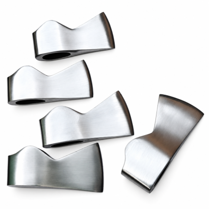 Five unhandled polished steel axe heads in different shapes arranged diagonally on white background