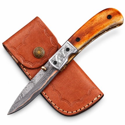 Amber-tone Damascus folding knife with a copper-colored wave along its patterned silver-gray blade, honey-brown handle, ornate silver bolster and metal pocket clip.