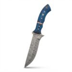 Blue grain handle knife with a broad gray patterned blade, copper-tone divider, four silver-tone pins, a mosaic-style pin, and a rear lanyard opening.