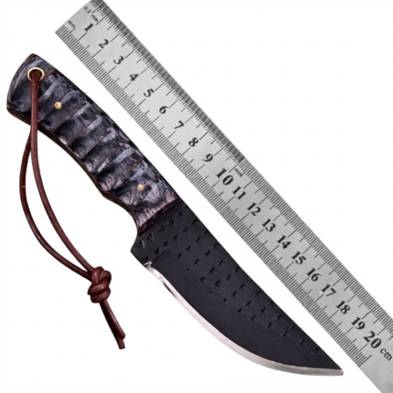 Black blade hunting knife with a curved silver-edged blade, dark brown woodgrain-style handle, blue marbled inlay, gold-colored pins and brown cord lanyard.