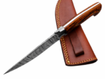 Damascus Hunting Knife with patterned upswept blade, bright orange-and-black wood-grain handle and three gold-tone circular fittings.