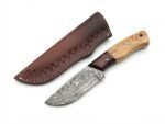 Two-Tone Wood Handle Damascus Hunting Knife with patterned drop-point blade, golden-brown and dark wood-grain handle, beside a brown stitched sheath.