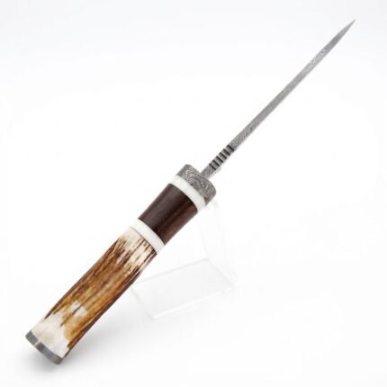Stag horn Damascus hunting knife with patterned silver-gray blade, cream-and-brown antler-look handle, metal guard and stitched brown sheath.