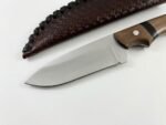 Wooden Handle Hunting Knife with broad satin-finished silver blade, curved brown wood-grain handle and dark brown embossed sheath with black edge lacing.