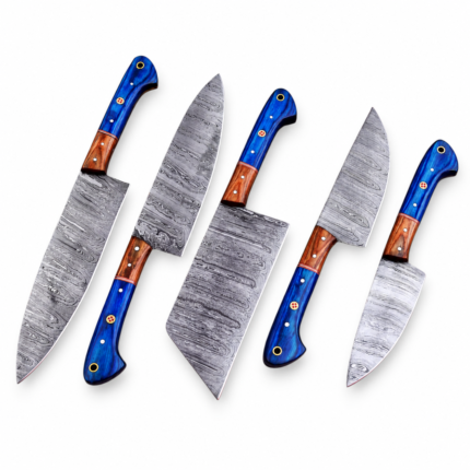 Five-piece blue handle kitchen knife set with patterned gray blades, brown handle accents, decorative pins, and a broad central cleaver-style knife.