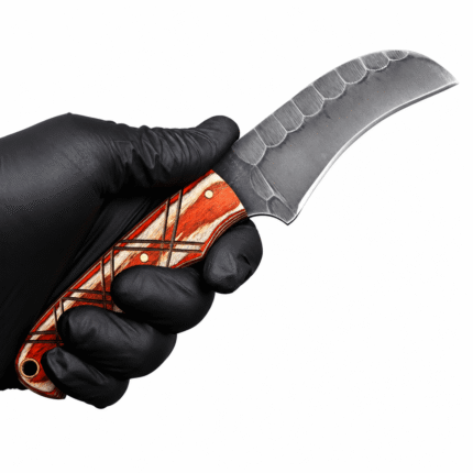 Curved skinning knife with a dark gray steel blade, reddish-brown wood-grain handle, cream inlays, geometric black patterns, brass-colored pins, and lanyard hole