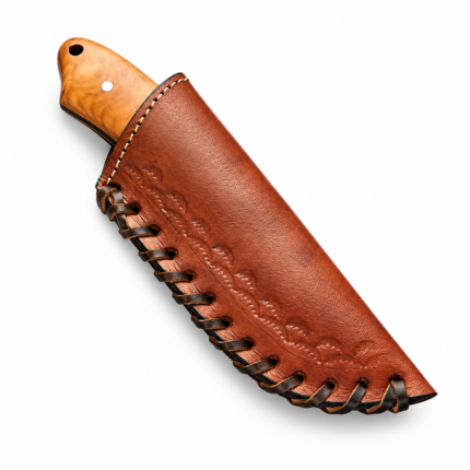 Close-up of Engraved Skinner Knife showing intricate floral scrollwork and polished curved silver blade