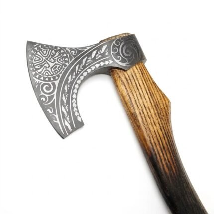Nordic Engraved Viking Axe featuring a silver-gray bearded blade with intricate knotwork patterns and a curved two-tone wooden handle on a white background.