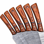 6 Piece Damascus Pattern Kitchen Knife Set showing six silver-gray patterned blades, orange-brown wood-look handles and dark brown buckle-strap knife roll