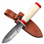 Textured fixed blade hunting knife with silver patterned blade, ivory-style handle, red accents, metal guard, and brown leather-style sheath