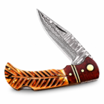 Damascus-style fixed blade knife handle with reddish-brown wood-look section, gold-colored spacers and curved finger contours