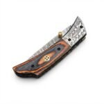 Damascus Pattern Folding Pocket Knife with engraved silver bolster, orange-and-black handle and brown stitched pouch