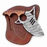 Damascus Pattern Mini Cleaver Knife with curved silver-gray patterned blade, circular and triangular cutouts, brown wood-grain handle and embossed sheath.