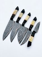 Damascus Pattern Fixed Blade Knife with pointed silver-gray patterned blade, black and ivory-style handle, decorative pins and metal-lined lanyard hole.