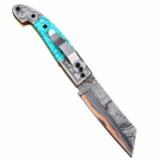 Turquoise Handle Damascus Folding Pocket Knife with silver floral engraved fittings, pocket clip, patterned angular blade and copper-colored accent