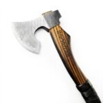 Black and silver bearded axe with a brown grain-look handle, dark overlapping grip wrap, flared handle end, and knotted lanyard.