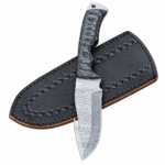 Black textured handle and patterned gut hook hunting knife positioned over stitched leather sheath