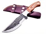 Hammered Pattern Hunting Knife with dark circular blade detailing, silver bevel, light brown wood-grain-look handle and burgundy double-strap sheath.