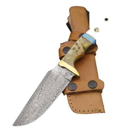 Tan handle fixed blade knife with a Damascus-style patterned blade, gold-tone guard, blue rear accent, and a separate black detail at the upper left.