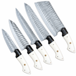 Damascus Pattern Chef Knife Set featuring six kitchen knives with layered-looking hammered-style blades, white and black handles, and gold-colored decorative pins on a white background.