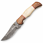 Bone Look Damascus Folding Knife with curved silver-and-charcoal patterned blade, ivory-colored center, brown wood-grain handle ends, red spacers and gold-tone details.