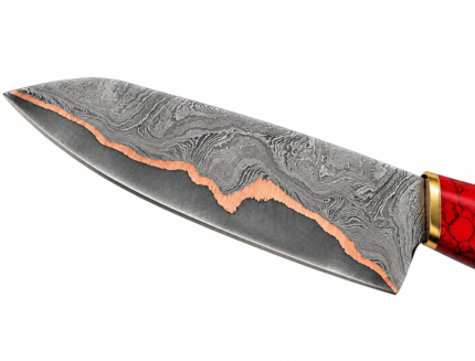 Copper Accent Damascus Pattern Knife close-up showing layered silver-gray blade details, a wavy copper-colored line, gold-tone collar and part of a red marbled handle.