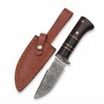 Dark Wood Damascus Hunting Knife with silver-gray patterned blade, gold-accented brown handle and stitched brown sheath with snap strap.