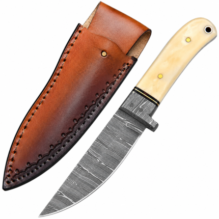 Cream handle hunting knife with black-and-silver Damascus-style patterned blade, gold-colored handle pins, small guard, and pointed blade