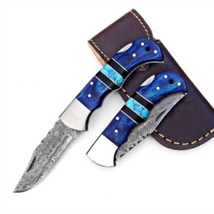 Blue Turquoise Damascus Folding Knife with detailed patterned blade, curved blue handle, turquoise-colored insert and brown storage pouch.