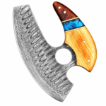 Damascus Pattern Ulu Knife with broad silver-and-charcoal crescent blade, detailed wave patterns, and wooden handle held in a black glove