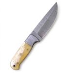 Cream Handle Damascus Hunting Knife with curved silver patterned blade, decorative metal bolster, pale ivory-look handle and reddish-brown stitched sheath