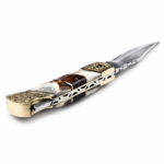 Ornate Brass Bolster Folding Knife with polished silver blade, engraved gold-tone floral fittings and curved brown and cream decorative handle.