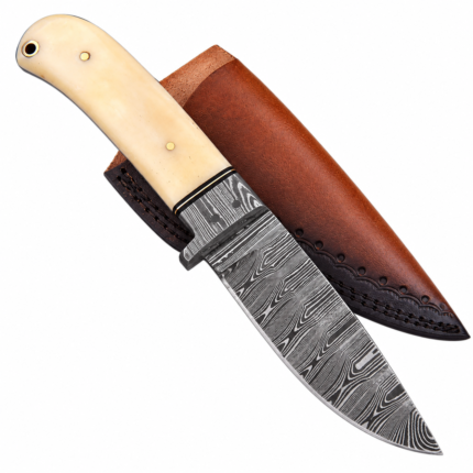 Cream handle hunting knife with black-and-silver Damascus-style patterned blade, gold-colored handle pins, small guard, and pointed blade