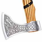 Engraved Viking Axe with ornate silver-colored head, curved golden-brown wood-look handle, black wrapping, gold-colored studs and hanging cord