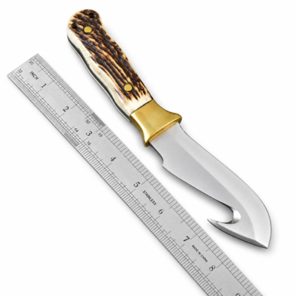 Gut Hook Hunting Knife with silver curved blade, brown and cream stag-style handle, gold bolster and matching brown sheath