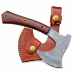 Close-up of Damascus Bearded Hatchet showing layered wave patterns across its broad curved metallic blade