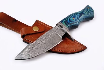 Blue Handle Damascus Hunting Knife with curved silver patterned blade, sculpted metal guard, turquoise blue grip and brown stitched sheath
