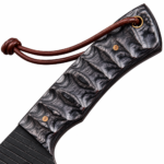 Black blade hunting knife with a curved silver-edged blade, dark brown woodgrain-style handle, blue marbled inlay, gold-colored pins and brown cord lanyard.
