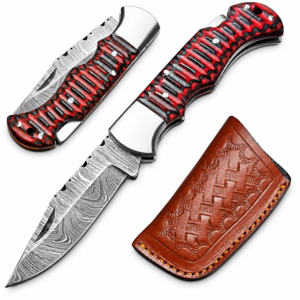 Open red and black folding knife with a deeply grooved handle, Damascus-style patterned blade, silver-tone bolster, and rear lanyard hole.