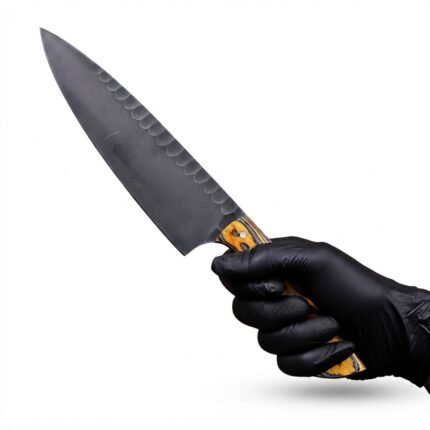 Black Blade Chef Knife with dark gray pointed blade, subtle scalloped detailing and yellow-gray patterned handle with three silver-colored pins
