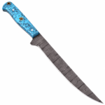 Long Damascus-patterned Bowie knife with a turquoise-blue handle, black matrix markings, decorative mosaic accent, metal pins, and curved pointed blade.