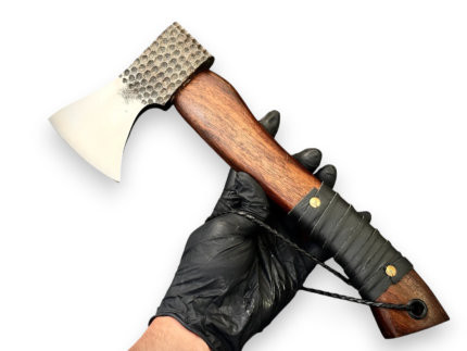 Hand Forged Viking Axe with hammered metal head, polished curved blade, natural wooden handle, and brown stitched leather-style sheath.