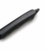Black Serrated Spine Hunting Knife with a curved dark blade, notched spine, contoured finger-groove handle and black stitched sheath with silver snap fasteners