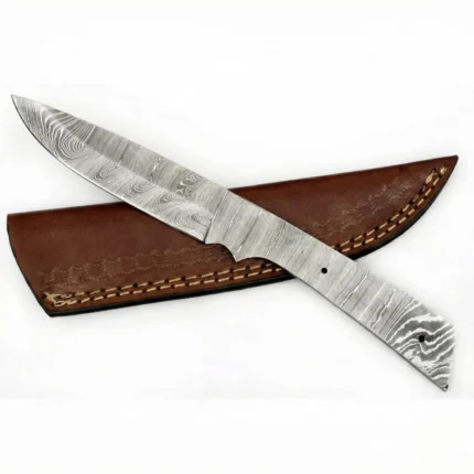 Full Tang Damascus Knife Blank with silver-grey wave patterns, pointed blade and two mounting holes on white background