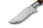 Orange black handle hunting knife with broad satin-silver blade, contoured two-tone grip, silver bolster and brown double-strap sheath