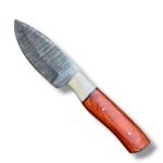 Reddish brown handle Damascus hunting knife featuring a silver-gray patterned fixed blade, cream front handle accent and brown stitched sheath
